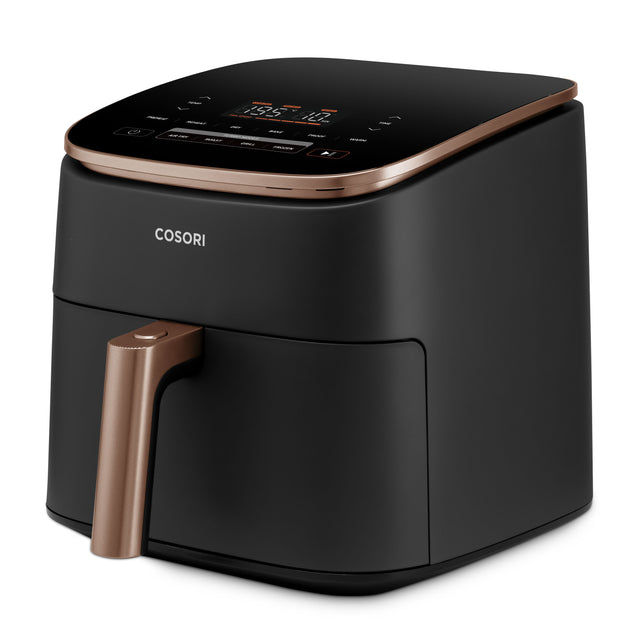 Angled view of black Cosori TurboBlaze Chef Edition 6L air fryer with bronze trim