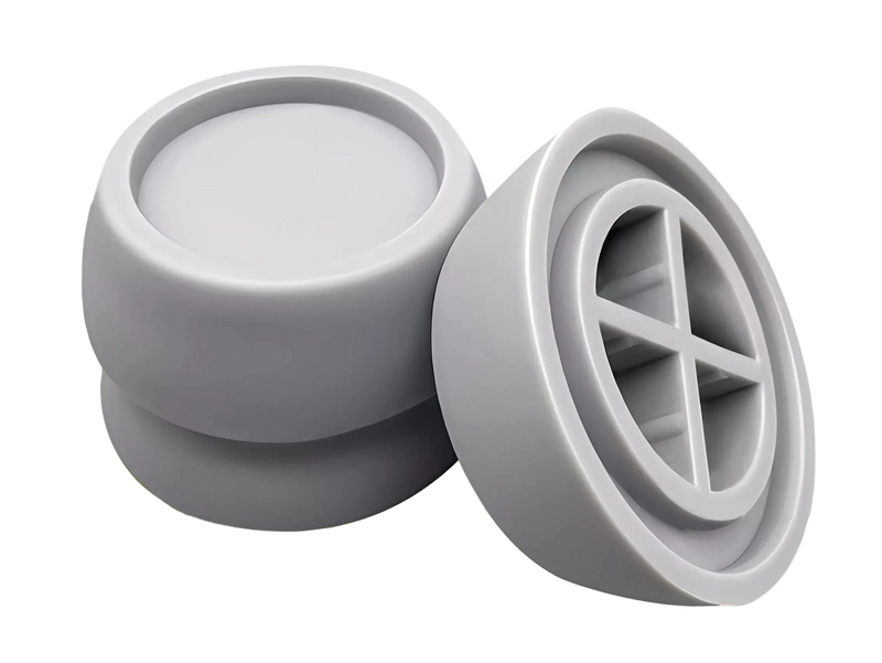 Grey Superior anti-vibration pads for washing machines and tumble dryers, showing top cups and ribbed undersides