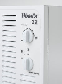 Wood's humidistat with control knobs on a white background