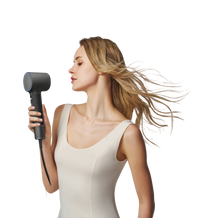 Woman drying her hair with the Laifen Neo Special hair dryer in Onyx Black